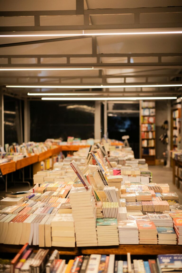 Explore a warm bookstore in São Paulo with neatly stacked books and inviting ambiance.